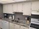 Kitchen with granite countertops and stainless steel appliances at 255 Dolphin Pt # 511, Clearwater Beach, FL 33767