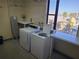 Shared laundry facility with washers and dryers at 255 Dolphin Pt # 511, Clearwater Beach, FL 33767