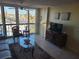 Living room with water view and tiled floors at 255 Dolphin Pt # 511, Clearwater Beach, FL 33767
