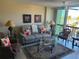 Living room with comfortable seating and water view at 255 Dolphin Pt # 511, Clearwater Beach, FL 33767