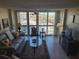 Living room with water view and tiled floors at 255 Dolphin Pt # 511, Clearwater Beach, FL 33767