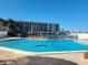 Inviting community pool with water view at 255 Dolphin Pt # 511, Clearwater Beach, FL 33767