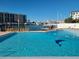 Community pool with dolphin design and marina view at 255 Dolphin Pt # 511, Clearwater Beach, FL 33767