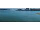 Scenic waterfront view with calm water and distant buildings at 255 Dolphin Pt # 511, Clearwater Beach, FL 33767