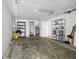 Unfinished garage with shelving and storage space at 2580 39Th N Ave, St Petersburg, FL 33714