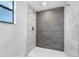 Modern shower with gray tile and a white shower pan at 2580 39Th N Ave, St Petersburg, FL 33714