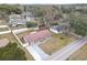 Aerial view of single-Gathering home, driveway, and yard at 27103 Frampton Ave, Brooksville, FL 34602