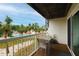 Balcony with table and chairs overlooking pool and courtyard at 274 Madeira Cir, St Petersburg, FL 33715