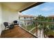 Private balcony overlooking the community pool and lush landscaping at 274 Madeira Cir, St Petersburg, FL 33715