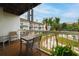 Private balcony with table and chairs overlooking courtyard at 274 Madeira Cir, St Petersburg, FL 33715