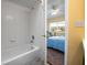 Clean bathroom with a tub and access to a bedroom at 274 Madeira Cir, St Petersburg, FL 33715