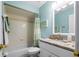 Charming bathroom with light blue walls, granite countertop, and a tub shower combo at 274 Madeira Cir, St Petersburg, FL 33715
