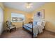 Comfortable bedroom with carpeted floors and a ceiling fan at 274 Madeira Cir, St Petersburg, FL 33715