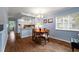 Bright dining area with hardwood floors and kitchen access at 274 Madeira Cir, St Petersburg, FL 33715