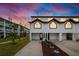 Two-story townhome with attached garage and landscaping at 274 Madeira Cir, St Petersburg, FL 33715