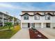 Two story home with attached garage and landscaping at 274 Madeira Cir, St Petersburg, FL 33715