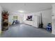 Workshop area in garage with cabinets and fridge at 274 Madeira Cir, St Petersburg, FL 33715