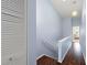 Light and airy hallway with wood flooring and a linen closet at 274 Madeira Cir, St Petersburg, FL 33715