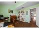 Spacious home office with built-in shelving and views into the living area at 274 Madeira Cir, St Petersburg, FL 33715