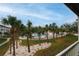 Community pool with lush landscaping and palm trees at 274 Madeira Cir, St Petersburg, FL 33715