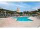 Community pool with surrounding buildings visible at 274 Madeira Cir, St Petersburg, FL 33715