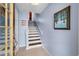 Well-lit staircase leading to the upper level at 274 Madeira Cir, St Petersburg, FL 33715