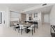 Open concept dining area with a large wood table and modern chairs at 301 1St S St # 1905, St Petersburg, FL 33701