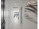 Bright hallway with modern doors and art leading to living area at 301 1St S St # 1905, St Petersburg, FL 33701