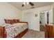 Charming bedroom with a daybed, built-in shelves, and ceiling fan at 3048 Orchard Dr, Palm Harbor, FL 34684