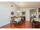 Dining area with hardwood floors and built-in wet bar at 3048 Orchard Dr, Palm Harbor, FL 34684