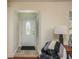Bright entryway with a white door and tiled floor at 3048 Orchard Dr, Palm Harbor, FL 34684
