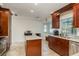 Kitchen boasts granite countertops and stainless steel appliances at 3048 Orchard Dr, Palm Harbor, FL 34684