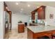 Kitchen with granite countertops, stainless steel appliances, and wood cabinets at 3048 Orchard Dr, Palm Harbor, FL 34684