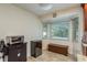 Kitchen nook with built-in bench seating and a view to the pool at 3048 Orchard Dr, Palm Harbor, FL 34684