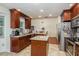 Spacious kitchen with stainless steel appliances and wood cabinets at 3048 Orchard Dr, Palm Harbor, FL 34684