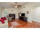 Bright living room features hardwood floors, fireplace, and neutral color palette at 3048 Orchard Dr, Palm Harbor, FL 34684