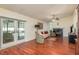 Living room with hardwood floors, fireplace, and access to pool at 3048 Orchard Dr, Palm Harbor, FL 34684