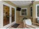Relaxing patio with seating area and view to dining room at 3048 Orchard Dr, Palm Harbor, FL 34684