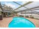 Enjoy this relaxing pool and patio area at 3048 Orchard Dr, Palm Harbor, FL 34684