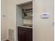 Built-in wet bar with granite countertop and shelving at 3048 Orchard Dr, Palm Harbor, FL 34684