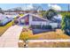 Attractive home with a nautical theme and driveway at 3113 Chamblee Ln, Clearwater, FL 33759
