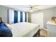Main bedroom with a king-size bed, blue accents, and plenty of closet space at 3113 Chamblee Ln, Clearwater, FL 33759
