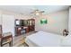 Bedroom with large TV, fireplace, and ample space for furniture at 3113 Chamblee Ln, Clearwater, FL 33759