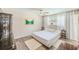 Spacious bedroom with a large bed, plenty of natural light, and wood-look flooring at 3113 Chamblee Ln, Clearwater, FL 33759
