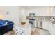 Modern kitchen with white cabinets, granite countertops, and stainless steel appliances at 3113 Chamblee Ln, Clearwater, FL 33759