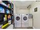 Convenient laundry room with washer, dryer, and extra storage at 3113 Chamblee Ln, Clearwater, FL 33759