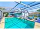 Inviting screened pool and patio area at 3113 Chamblee Ln, Clearwater, FL 33759
