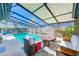 Relaxing pool area with covered patio and seating at 3113 Chamblee Ln, Clearwater, FL 33759