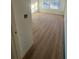 Spacious bedroom with wood-look flooring and large windows at 3307 W Oak Ave, Plant City, FL 33563
