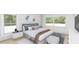 Main bedroom with plush bedding and stylish decor at 3307 W Oak Ave, Plant City, FL 33563